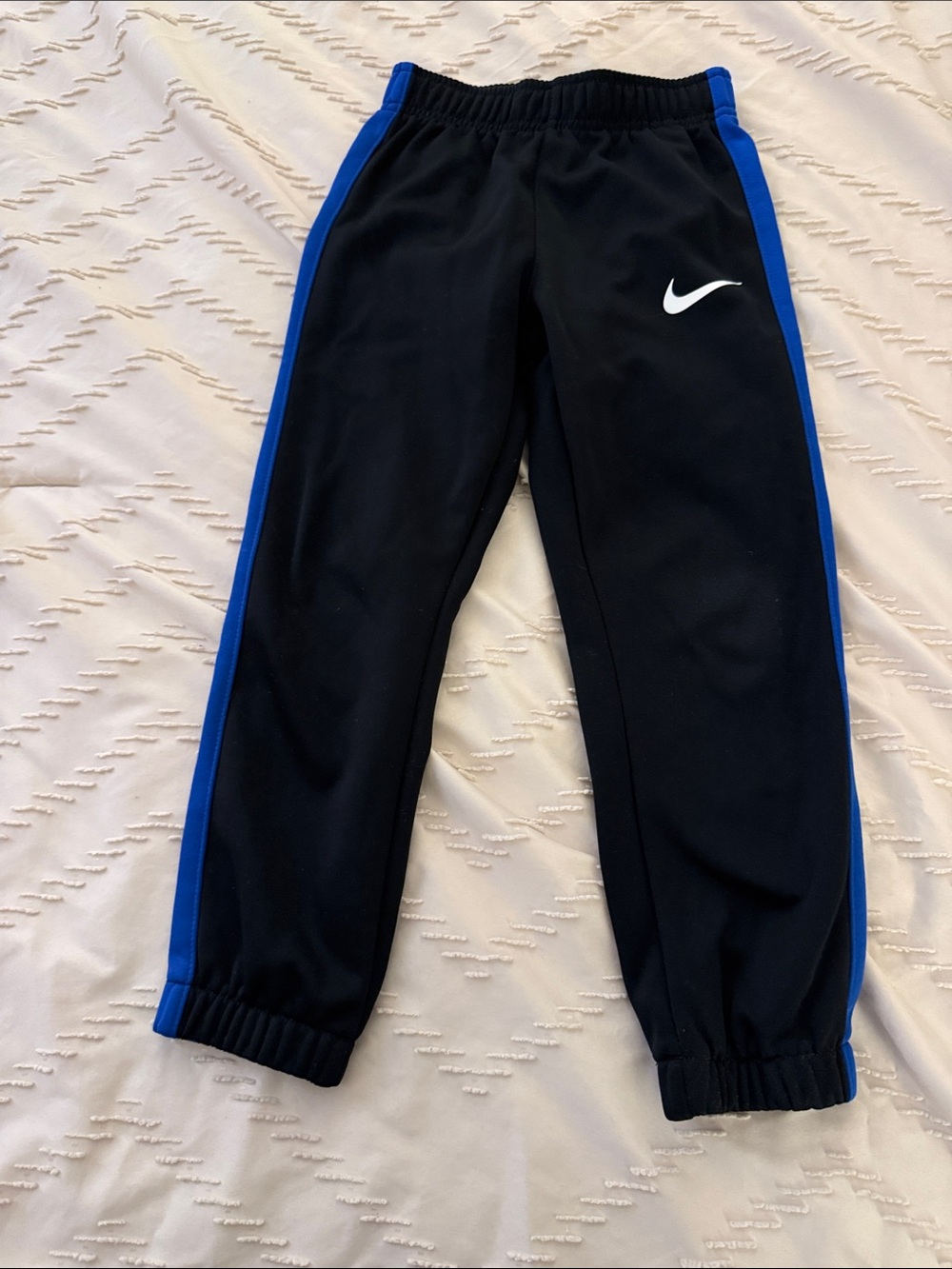 Nike Kids Black Sweatpants with Blue Side Panels